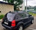 Черный Хендай Туксон, объемом двигателя 2 л и пробегом 152 тыс. км за 7800 $, фото 1 на Automoto.ua
