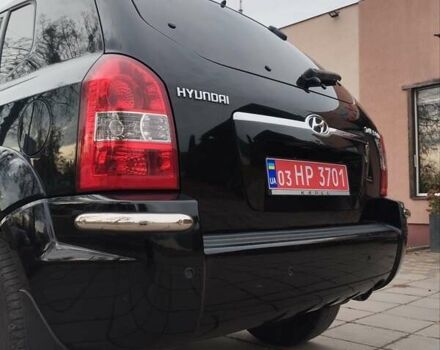 Черный Хендай Туксон, объемом двигателя 1.98 л и пробегом 214 тыс. км за 7700 $, фото 9 на Automoto.ua