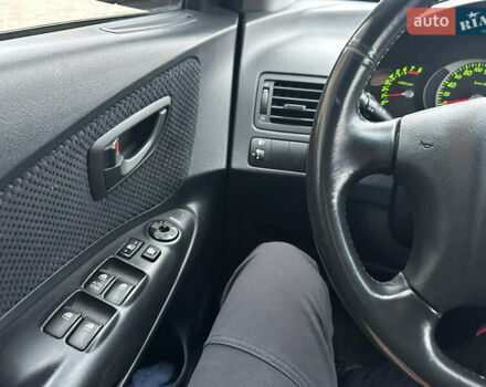 Чорний Хендай Туксон, об'ємом двигуна 2 л та пробігом 243 тис. км за 7999 $, фото 36 на Automoto.ua