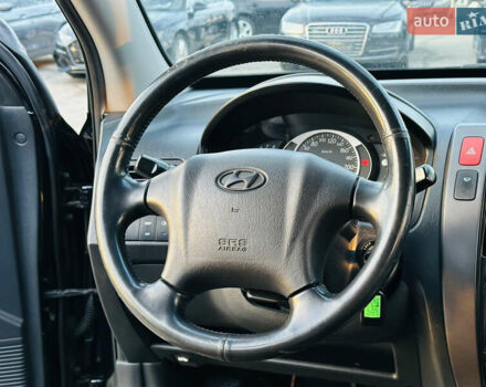 Чорний Хендай Туксон, об'ємом двигуна 2 л та пробігом 186 тис. км за 8300 $, фото 19 на Automoto.ua