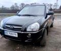 Черный Хендай Туксон, объемом двигателя 2 л и пробегом 235 тыс. км за 9300 $, фото 1 на Automoto.ua