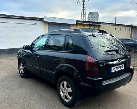 Черный Хендай Туксон, объемом двигателя 2 л и пробегом 215 тыс. км за 6700 $, фото 5 на Automoto.ua