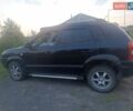 Черный Хендай Туксон, объемом двигателя 1.99 л и пробегом 239 тыс. км за 7700 $, фото 4 на Automoto.ua