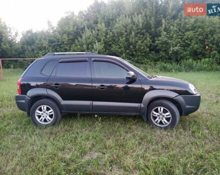 Черный Хендай Туксон, объемом двигателя 2 л и пробегом 440 тыс. км за 8000 $, фото 6 на Automoto.ua