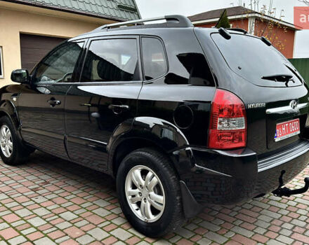 Чорний Хендай Туксон, об'ємом двигуна 2 л та пробігом 182 тис. км за 8299 $, фото 9 на Automoto.ua