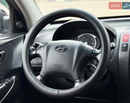 Черный Хендай Туксон, объемом двигателя 1.99 л и пробегом 240 тыс. км за 7200 $, фото 56 на Automoto.ua