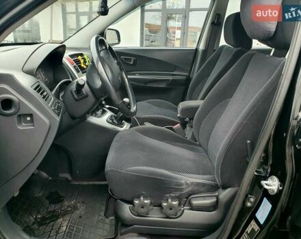 Чорний Хендай Туксон, об'ємом двигуна 2 л та пробігом 225 тис. км за 8000 $, фото 39 на Automoto.ua