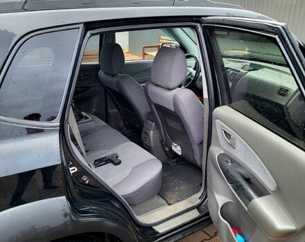 Черный Хендай Туксон, объемом двигателя 2 л и пробегом 223 тыс. км за 7500 $, фото 3 на Automoto.ua