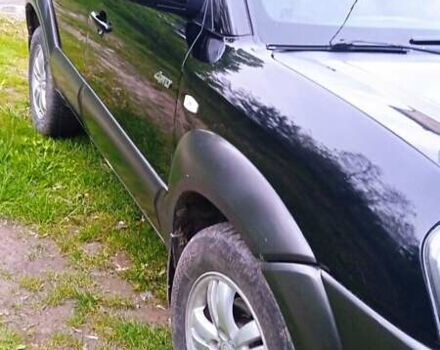 Черный Хендай Туксон, объемом двигателя 1.98 л и пробегом 200 тыс. км за 6600 $, фото 2 на Automoto.ua