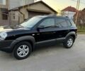 Черный Хендай Туксон, объемом двигателя 2 л и пробегом 210 тыс. км за 6900 $, фото 1 на Automoto.ua