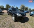 Черный Хендай Туксон, объемом двигателя 2 л и пробегом 225 тыс. км за 8200 $, фото 1 на Automoto.ua
