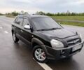 Чорний Хендай Туксон, об'ємом двигуна 2 л та пробігом 255 тис. км за 8950 $, фото 1 на Automoto.ua
