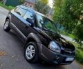 Черный Хендай Туксон, объемом двигателя 2 л и пробегом 293 тыс. км за 7700 $, фото 1 на Automoto.ua
