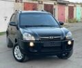 Черный Хендай Туксон, объемом двигателя 2 л и пробегом 167 тыс. км за 6812 $, фото 1 на Automoto.ua