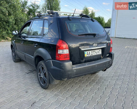 Черный Хендай Туксон, объемом двигателя 1.98 л и пробегом 250 тыс. км за 7200 $, фото 8 на Automoto.ua