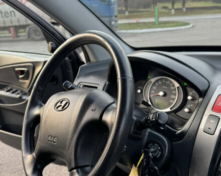 Черный Хендай Туксон, объемом двигателя 2 л и пробегом 210 тыс. км за 7850 $, фото 32 на Automoto.ua