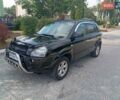 Черный Хендай Туксон, объемом двигателя 2 л и пробегом 260 тыс. км за 6950 $, фото 1 на Automoto.ua