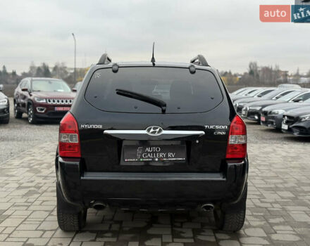 Чорний Хендай Туксон, об'ємом двигуна 2 л та пробігом 240 тис. км за 6888 $, фото 8 на Automoto.ua