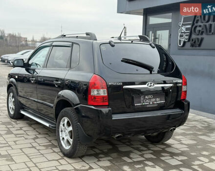 Чорний Хендай Туксон, об'ємом двигуна 2 л та пробігом 240 тис. км за 6888 $, фото 10 на Automoto.ua