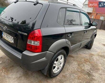 Черный Хендай Туксон, объемом двигателя 1.98 л и пробегом 290 тыс. км за 7000 $, фото 5 на Automoto.ua