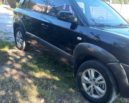 Чорний Хендай Туксон, об'ємом двигуна 2 л та пробігом 162 тис. км за 8800 $, фото 2 на Automoto.ua