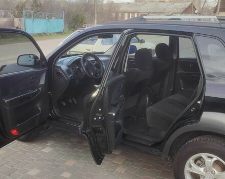 Чорний Хендай Туксон, об'ємом двигуна 2 л та пробігом 214 тис. км за 6000 $, фото 8 на Automoto.ua