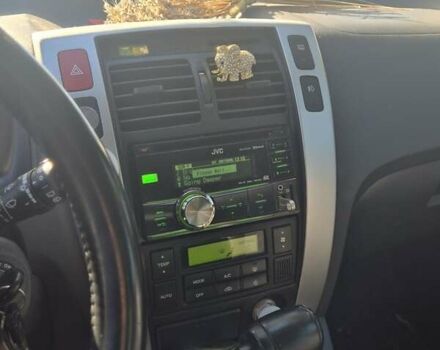 Черный Хендай Туксон, объемом двигателя 1.98 л и пробегом 93 тыс. км за 11800 $, фото 6 на Automoto.ua