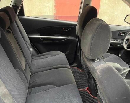 Черный Хендай Туксон, объемом двигателя 2 л и пробегом 270 тыс. км за 7600 $, фото 4 на Automoto.ua