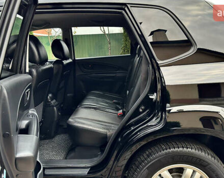 Чорний Хендай Туксон, об'ємом двигуна 2 л та пробігом 182 тис. км за 8299 $, фото 49 на Automoto.ua