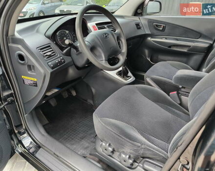 Черный Хендай Туксон, объемом двигателя 2 л и пробегом 137 тыс. км за 8400 $, фото 17 на Automoto.ua
