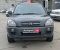 Черный Хендай Туксон, объемом двигателя 2 л и пробегом 214 тыс. км за 7690 $, фото 1 на Automoto.ua
