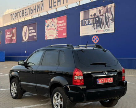 Черный Хендай Туксон, объемом двигателя 2 л и пробегом 161 тыс. км за 8300 $, фото 7 на Automoto.ua