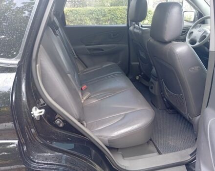 Чорний Хендай Туксон, об'ємом двигуна 2 л та пробігом 260 тис. км за 6750 $, фото 6 на Automoto.ua