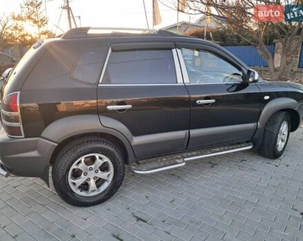 Черный Хендай Туксон, объемом двигателя 1.98 л и пробегом 233 тыс. км за 7850 $, фото 6 на Automoto.ua