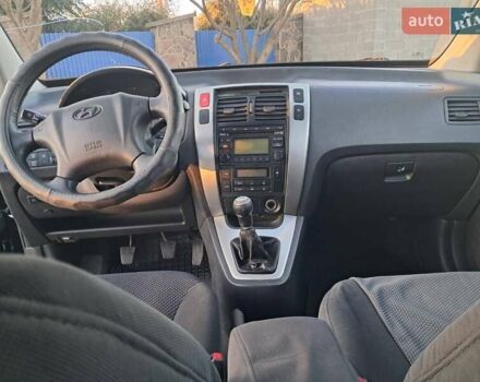 Черный Хендай Туксон, объемом двигателя 1.98 л и пробегом 233 тыс. км за 7850 $, фото 12 на Automoto.ua