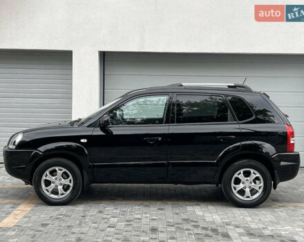 Чорний Хендай Туксон, об'ємом двигуна 2 л та пробігом 163 тис. км за 9199 $, фото 12 на Automoto.ua