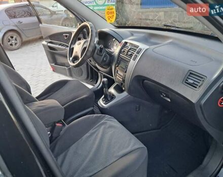 Черный Хендай Туксон, объемом двигателя 1.98 л и пробегом 233 тыс. км за 7850 $, фото 15 на Automoto.ua