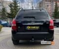 Чорний Хендай Туксон, об'ємом двигуна 2 л та пробігом 246 тис. км за 7999 $, фото 5 на Automoto.ua