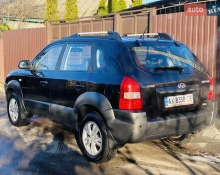Черный Хендай Туксон, объемом двигателя 1.99 л и пробегом 95 тыс. км за 8700 $, фото 4 на Automoto.ua