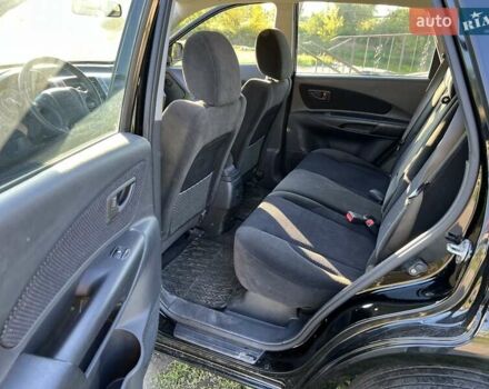 Черный Хендай Туксон, объемом двигателя 2 л и пробегом 198 тыс. км за 8200 $, фото 16 на Automoto.ua