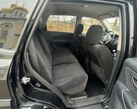 Черный Хендай Туксон, объемом двигателя 2 л и пробегом 128 тыс. км за 9200 $, фото 8 на Automoto.ua