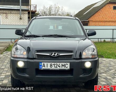 Чорний Хендай Туксон, об'ємом двигуна 2 л та пробігом 200 тис. км за 8499 $, фото 4 на Automoto.ua