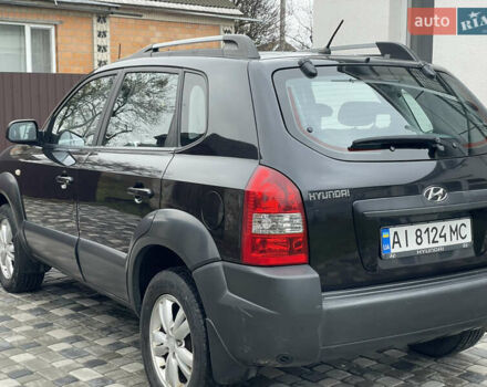 Чорний Хендай Туксон, об'ємом двигуна 2 л та пробігом 200 тис. км за 8450 $, фото 5 на Automoto.ua
