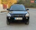 Черный Хендай Туксон, объемом двигателя 2 л и пробегом 148 тыс. км за 8700 $, фото 1 на Automoto.ua