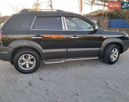 Черный Хендай Туксон, объемом двигателя 1.98 л и пробегом 233 тыс. км за 7850 $, фото 5 на Automoto.ua