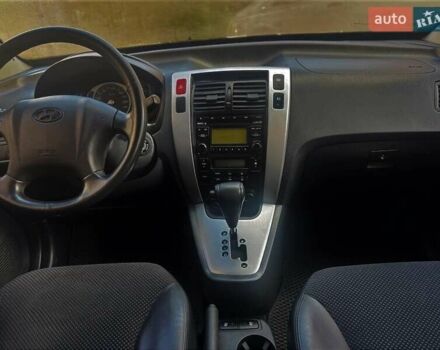 Черный Хендай Туксон, объемом двигателя 2 л и пробегом 91 тыс. км за 11400 $, фото 3 на Automoto.ua