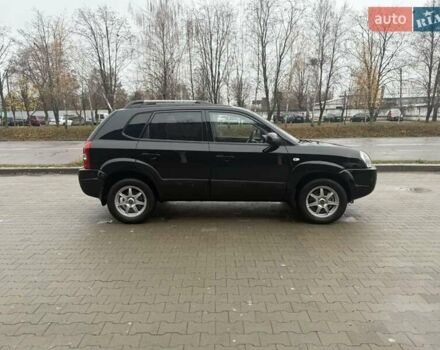 Черный Хендай Туксон, объемом двигателя 2 л и пробегом 237 тыс. км за 8350 $, фото 12 на Automoto.ua