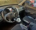 Черный Хендай Туксон, объемом двигателя 2 л и пробегом 91 тыс. км за 11400 $, фото 5 на Automoto.ua