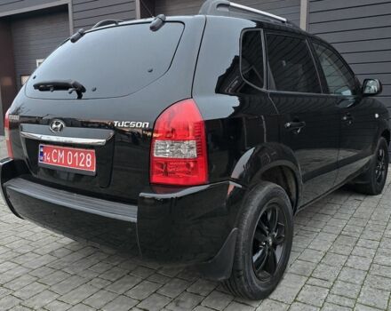 Черный Хендай Туксон, объемом двигателя 2 л и пробегом 198 тыс. км за 7999 $, фото 1 на Automoto.ua