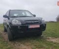 Черный Хендай Туксон, объемом двигателя 2 л и пробегом 198 тыс. км за 8200 $, фото 1 на Automoto.ua